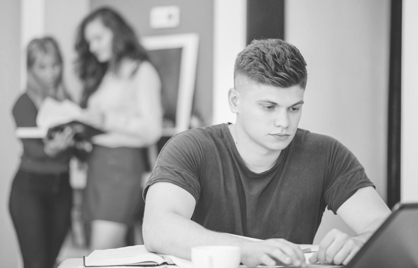 Business mentor reviewing startup pitch presentation with entrepreneur in professional setting